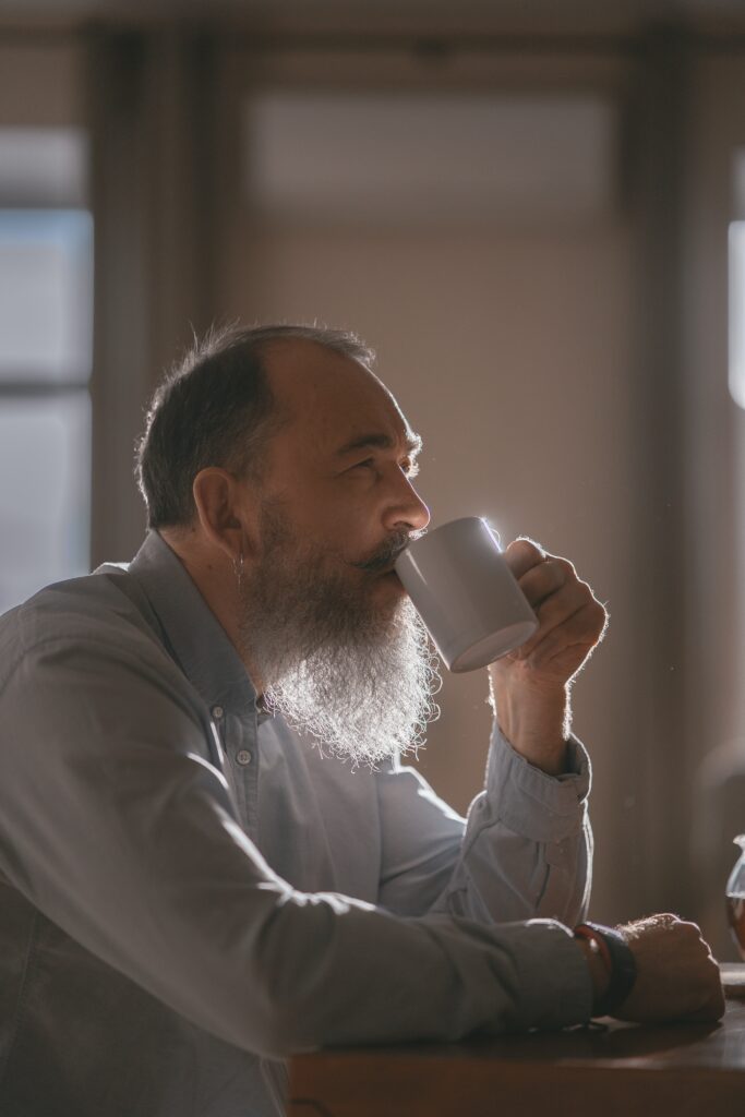 Man with beard drinking Maca tea